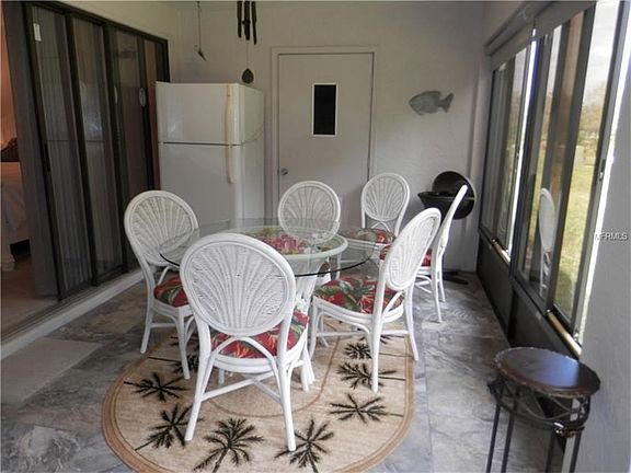 New Impact Resistant Windows and New Porcelain Lanai Tiles Overlooking the 6th Fairway