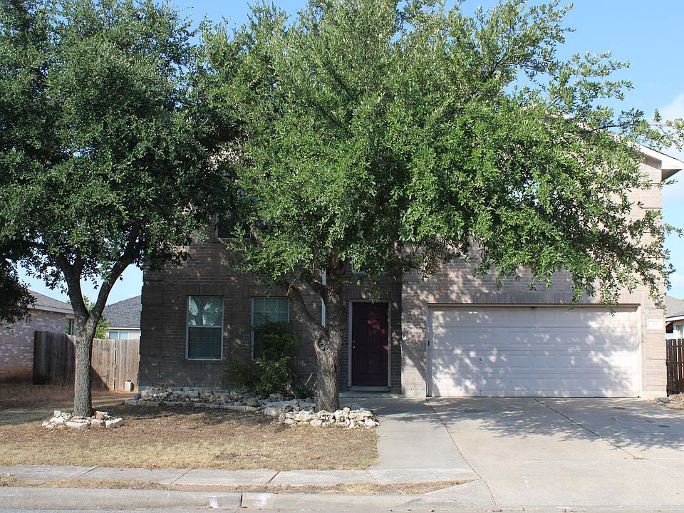 Shade trees grace the front of this home with 4 bedrooms plus and office