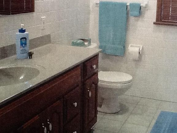 Oversized ceramic tiled bathroom