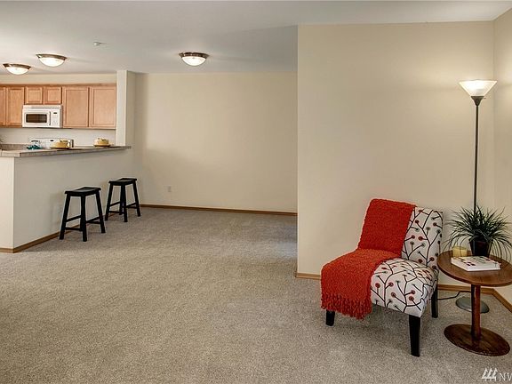 Open concept kitchen adjoins dining area. Well lit and bright even on a dark day!