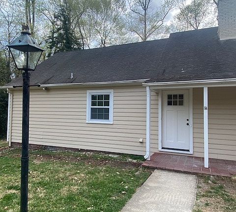 Main Front Door to hallway - leads to bedrooms on left, family room straight ahead, and laundry room on right