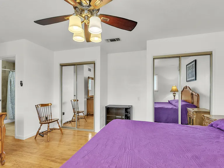 California King sleep number bed with two closets, one dresser amd private bathroom.