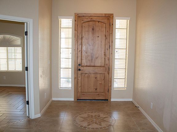 Front door with tile mosaic