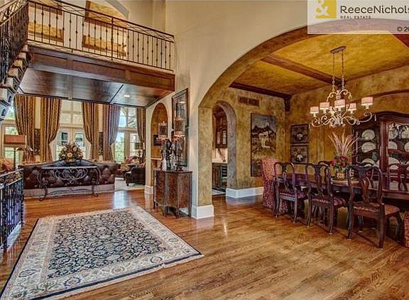 Second floor balconies overlook formal dining room and hearth room