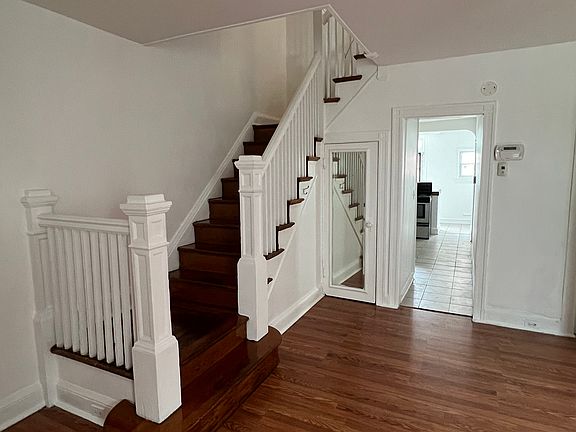 Living room + hallway to kitchen + stairs to upper levels
