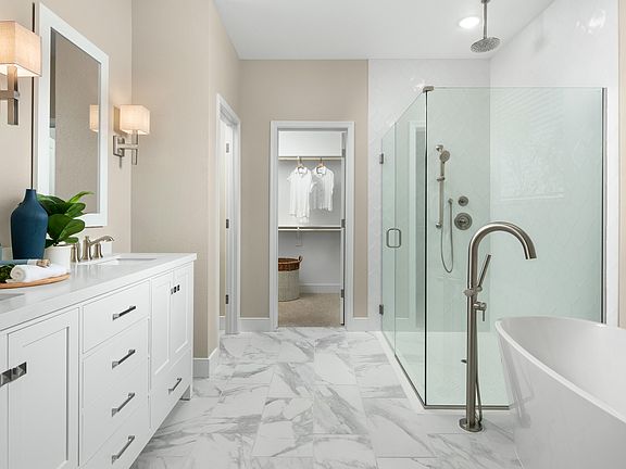 Primary bath with dual sinks and brushed nickel fixtures throughout