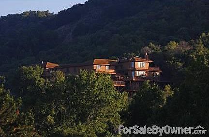 House situated up on a hill
						:
						Spectacular view of the bay on 3.5 acres with orchard, green house, solar power.