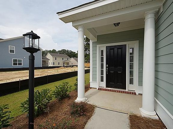 Photos are of a similar home