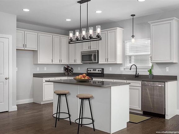 Virtually enhanced to show off the kitchen.