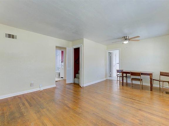 Living/dining area looking from front door area into hall/kitchen