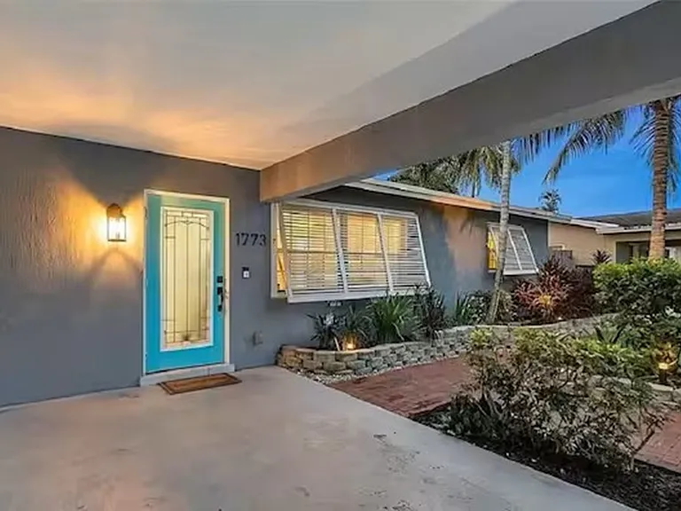 Front of House Provides Carport for Crucial Protection from Rain & Hot Florida Sun