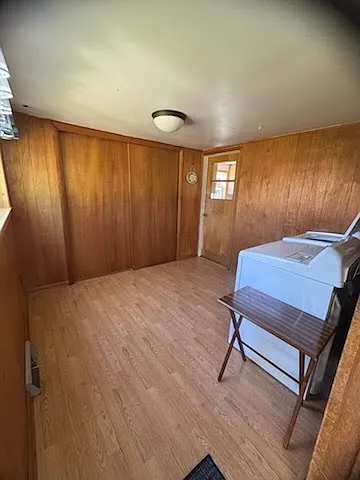 Laundry area with plenty of space and a closet
