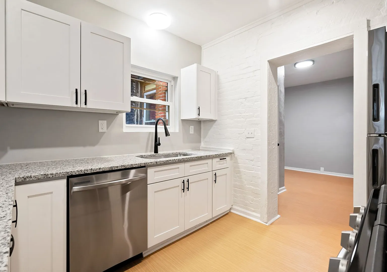 Renovated 2 Bed, 1.5 Bath Rowhome in Hazelwood - Central AC & Heat, Laundry - Available Now! — Photo 2
