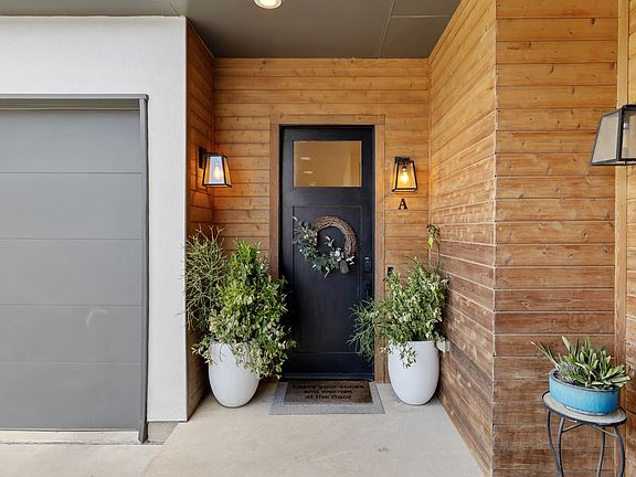 Welcoming front door and one-car garage