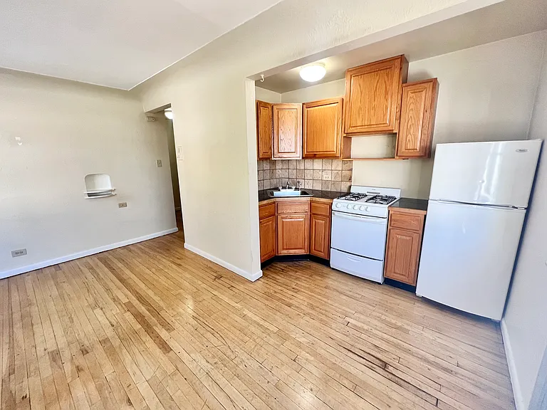 Experience the charm of this cozy kitchen and open living area, perfect for modern living. Experience the charm of this cozy kitchen and open living area, perfect for modern living.