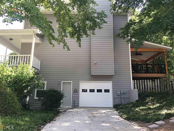 Side view of home showing the boat door - has it's own driveway!