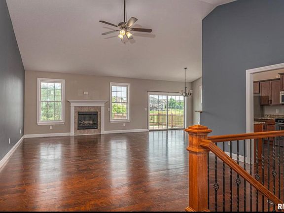 Foyer entry view to living room, dining and kitchen to the right