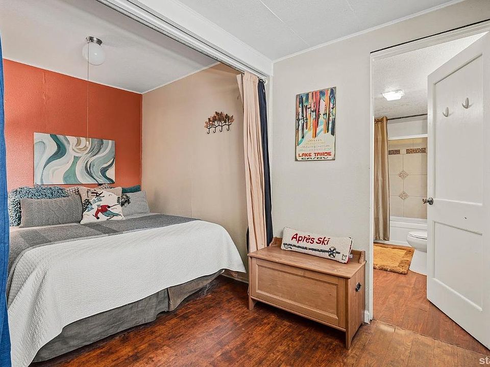 Queen bed sleeping area. Bathroom is adjacent.