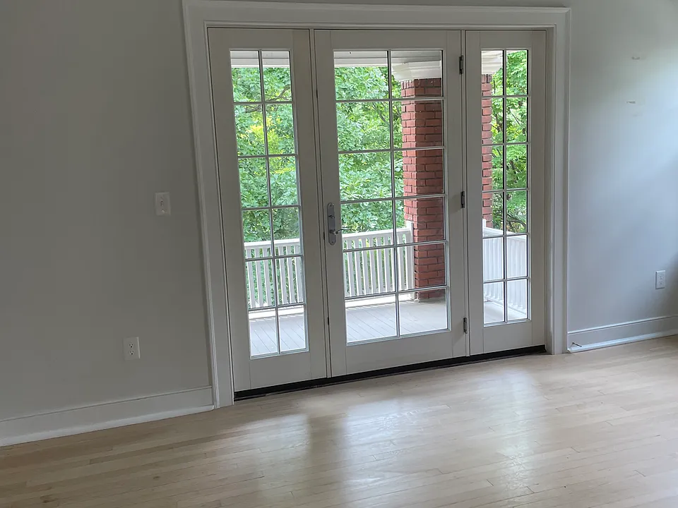 French doors that lead out to the balcony from the living room.
