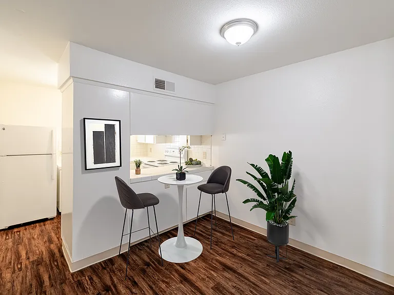 Dining nook with contemporary design and warm flooring.