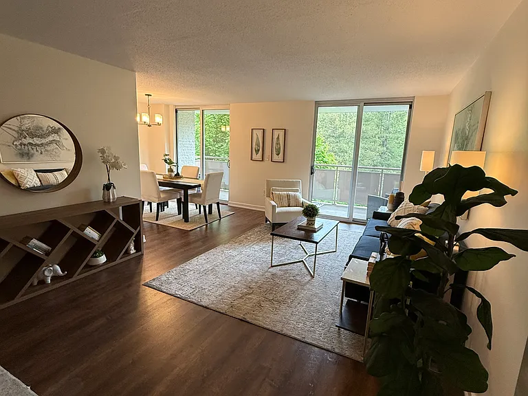 Living area with view of balcony and dining area