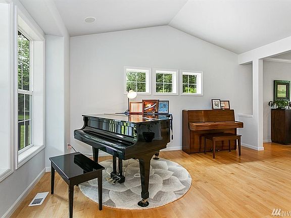 Vaulted ceiling in large front room.  Opens to formal dining room.