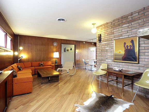Just off the flagstone floored entry is the main living area. Brick interior accent walls, recent ha