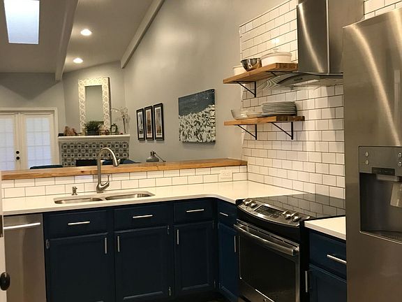 Kitchen and bar area overlooking livingroom
