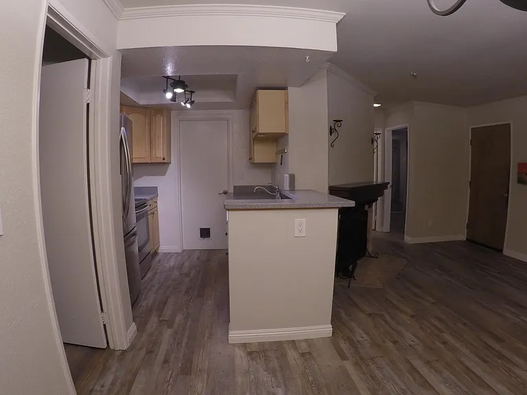 fireplace, kitchen, and garage divide the 2 bedroom wings