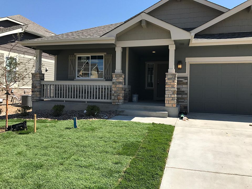 Front of home with three car garage.