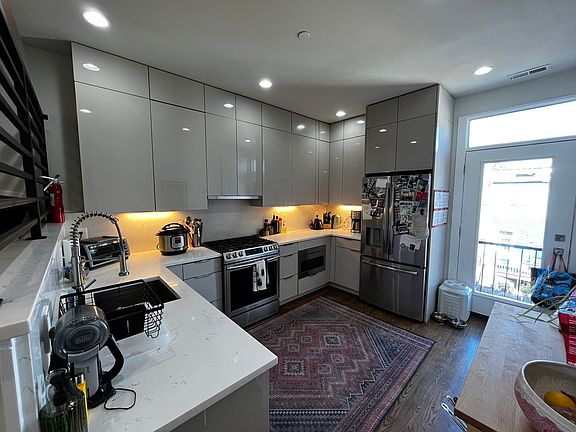 Spacious kitchen, with Juliet balcony looking out onto a private parking space