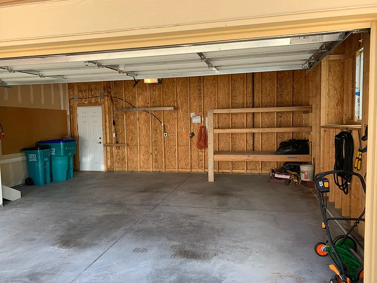 Two car garage with built in shelves