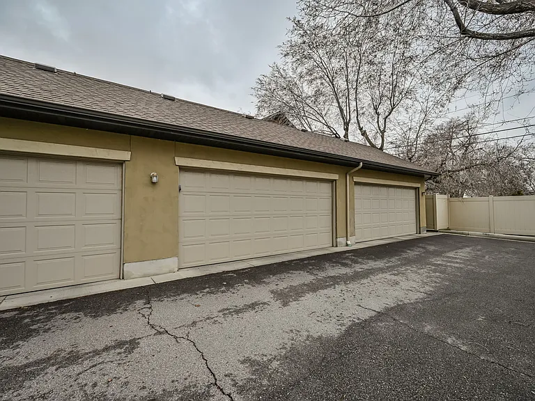 2 car garage behind townhouse, accessible via backdoor / patio