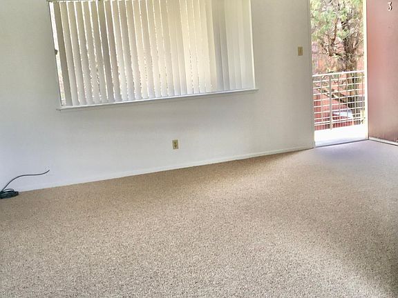 Living room and entrance view (from kitchen/dining)