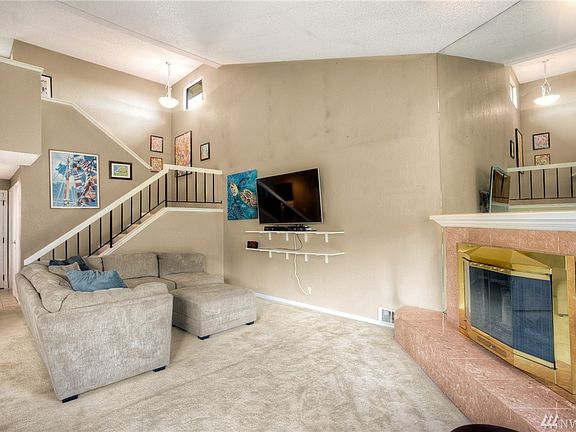 Wood burning fire place is a nice focal point for this living room.