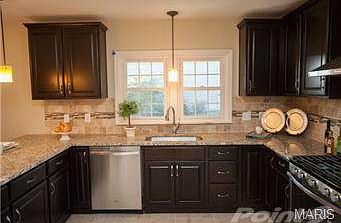 Spacious and open kitchen with soft close cabinets, granite coun