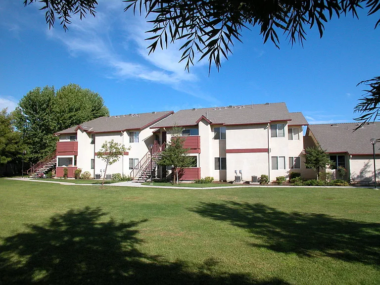 Building Exterior View From Grass Area