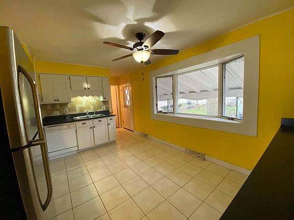 Kitchen has bay window.