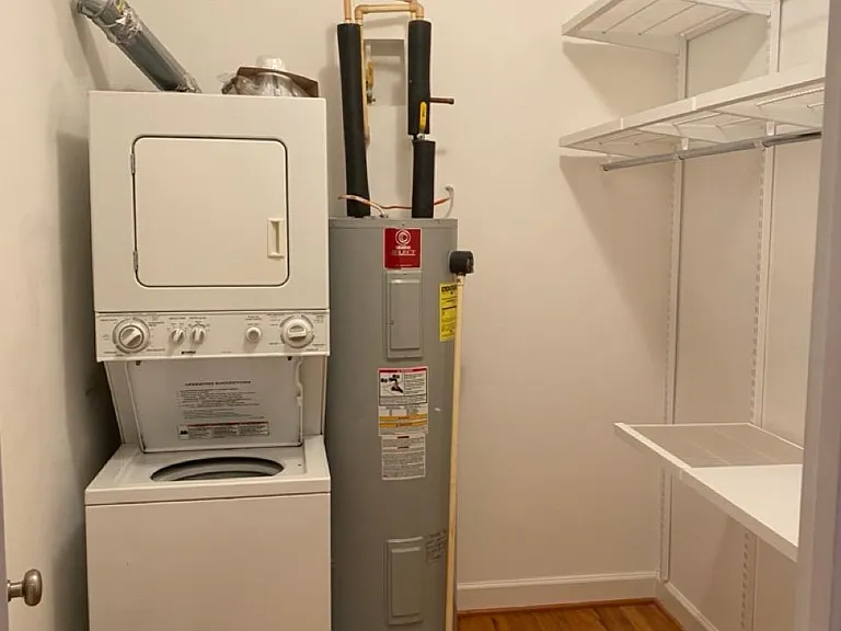 Closet with washer/dryer and custom Elfa storage!