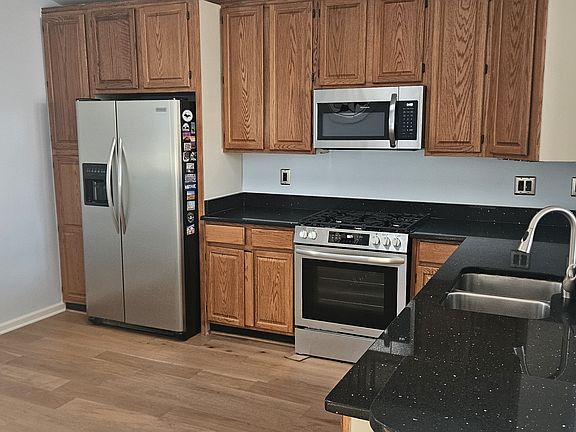 Kitchen with brand new microwave, gas range and dish washer
