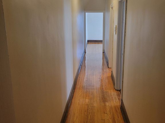 Hallway to second bedroom, dining room & kitchen