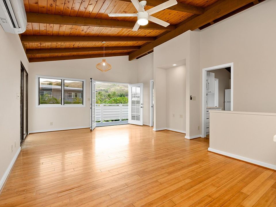 Living Room looking towards Lanikai Pillbox. Incredible Breeze, vaulted Ceilings, New Paint Bamboo Flooring, New Lights, Fan and Split AC.