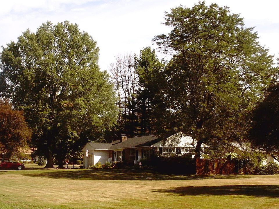 .96 acres in quiet neighborhood surrounded by mature trees.