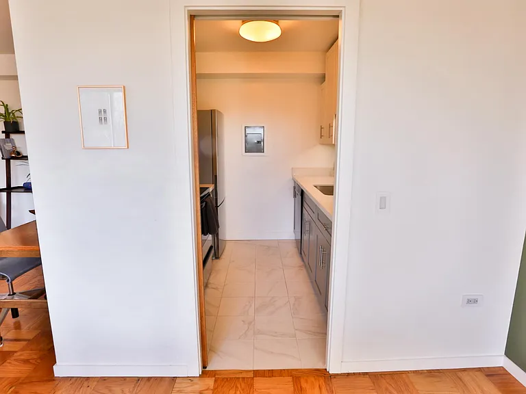 Next to the dining area, there is a a full-sized kitchen that can be closed off with a pocket door.