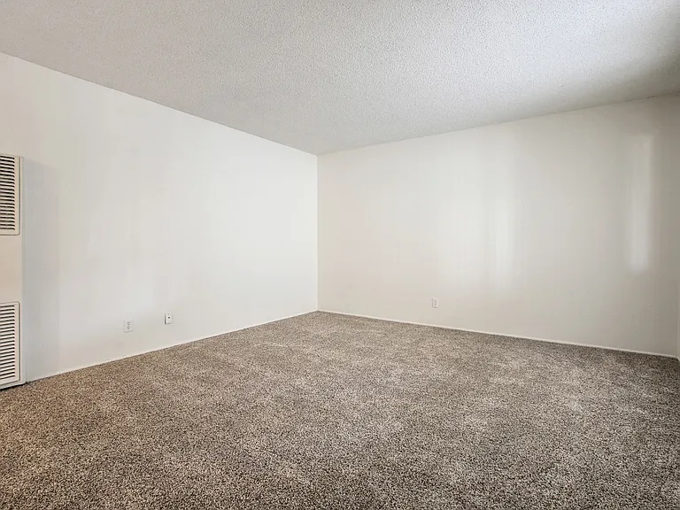 Living room with air conditioning, carpeted flooring