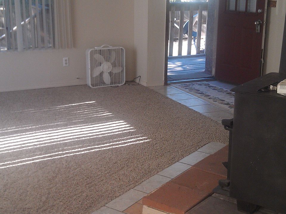 living room with wood stove