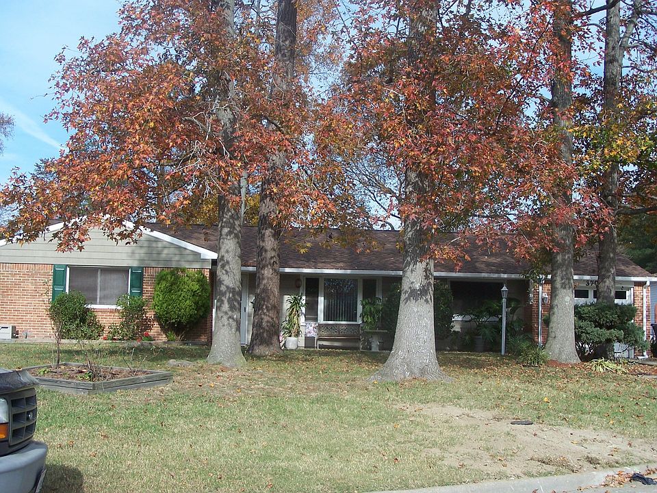 Exterior front with new siding and roof