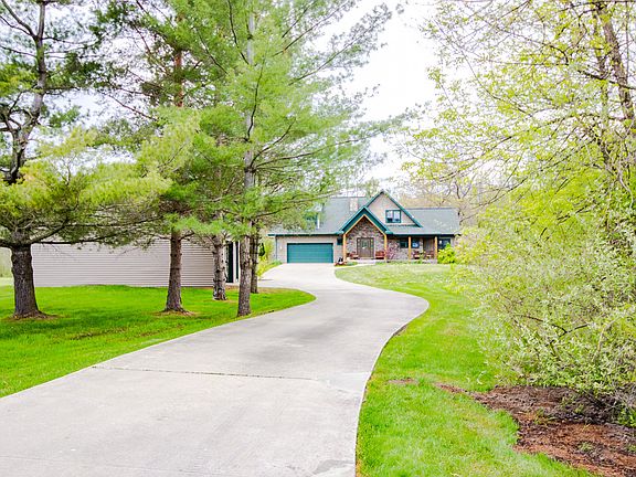 Winding concrete driveway right to the garage entrance