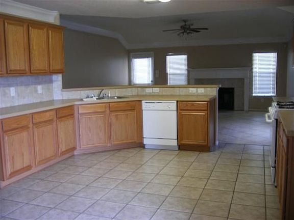 Breakfast bar separates spacious kitchen from living area