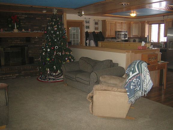Fireplace in living room....."like wood" laminate floors in living room and kitchen.